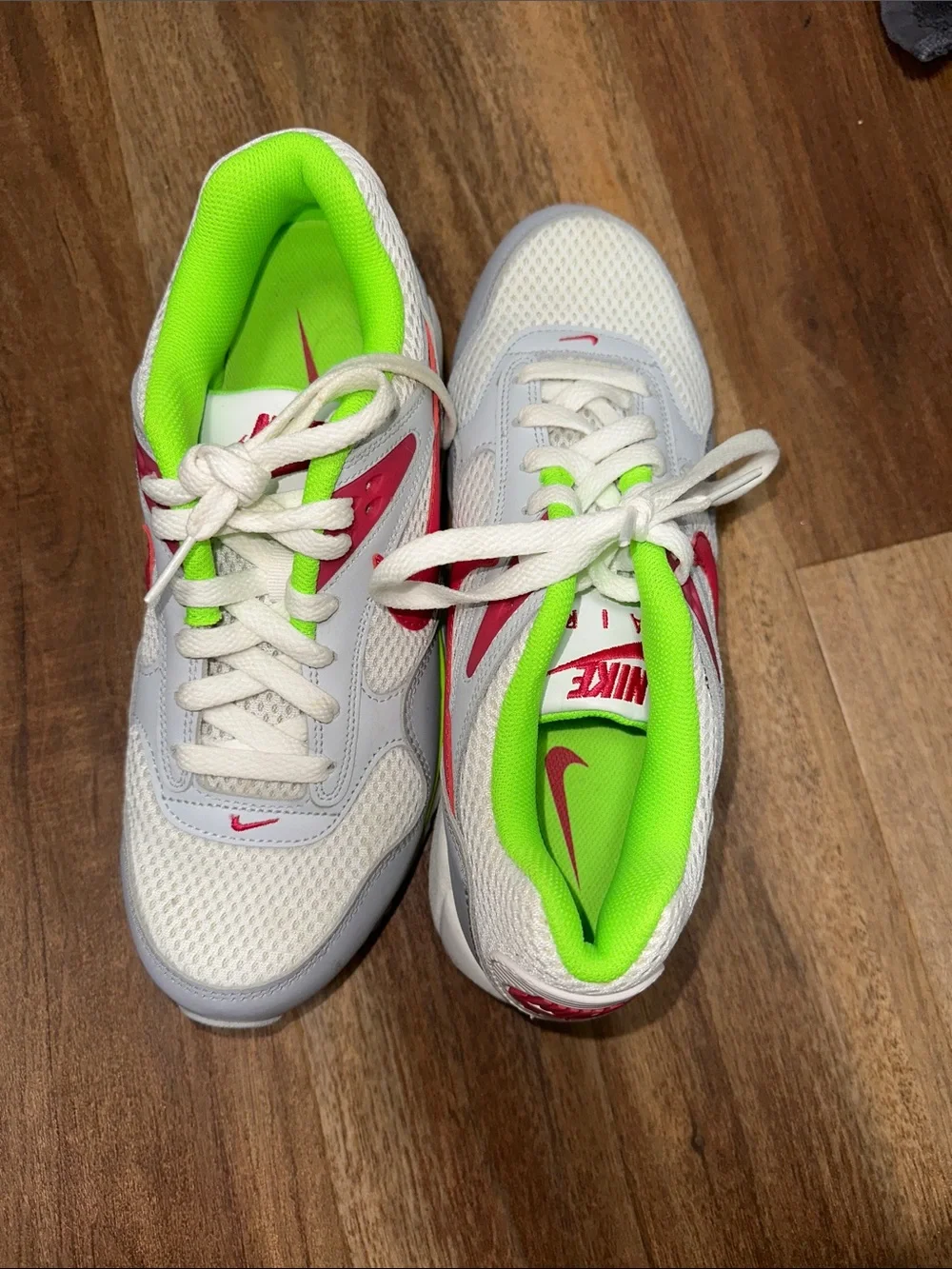Nike White Athletic Sneakers with Neon Green Lining and Red Swoosh